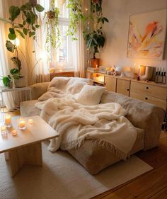 a living room filled with furniture and candles