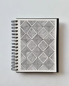 a black and white notebook sitting on top of a table