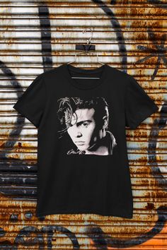 Cry-Baby Johnny Depp Unisex Tee Shirt for Johnny Depp fans. This classic unisex jersey short sleeve tee fits like a well-loved favorite. Soft cotton and quality print make users fall in love with it over and over again. These t-shirts have-ribbed knit collars to bolster shaping. The shoulders have taping for better fit over time. Dual side seams hold the garment's shape for longer. \n.: 100% Airlume combed and ringspun cotton (fiber content may vary for different colors)\n.: Light fabric (4.2 oz Unisex Cotton T-shirt For Fan Merchandise, Pop Culture Fan Merchandise Crew Neck Shirt, Unisex Graphic Print Shirt For Fan Merchandise, Unisex Fan Merchandise Top With Front Print, Unisex Crew Neck T-shirt For Fan Merchandise, Unisex Character Print T-shirt For Fan Merchandise, Graphic Tee T-shirt For Fan Merchandise, Pop Culture Short Sleeve T-shirt With Front Print, Unisex Crew Neck T-shirt For Pop Culture