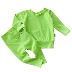 ♥ ABOUT THIS SET ⚬ Unisex sizes newborn to 3/4T. ⚬ This is a long sleeve top with matching leggings only. ⚬ Made of a soft and stretchy blend knit fabric that feels great to the touch, wears well and looks fabulous. ⚬ Pullovers have a stretchy neck band and a loose fit. ⚬ Leggings have a wide waist band, are very comfy and fit any baby extremely well while sitting, standing, walking or crawling. ⚬ Each item is handmade with lots of love! ♥AVAILABLE COLORS For choice of other solid color ( see last photos ), please leave color selection in comments at checkout. ♥SIZING Sizes runs on the looser on size!  ♥ PLEASE NOTE Actual color may vary from photos due to different screen resolutions and pattern placement will vary as this is the nature of handmade and made to order items. Thank you! This Playful Long Sleeve Tops With Matching Set, Green Cotton Crew Neck Sets, Playful Solid Color Cotton Sets, Green Cotton Sets For Playtime, Green Cotton Playtime Sets, Green Relaxed Fit Tops For Playwear, Relaxed Fit Green Tops For Playwear, Green Cotton Long Sleeve Sets, Playful Green Cotton Sweatshirt