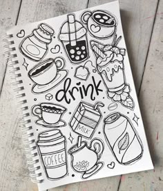 a notebook with doodles on it and the words drink written in black ink