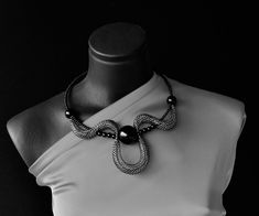 "Statement black and silver collar, Short elegant necklace, Contemporary necklace, Unusual necklace, Fashion necklace, Modern necklace, Chic necklace. Statement eye catching black and silver necklace, Contemporary choker necklace. Attractive stylish modern collar.  Light and comfortable to wear, easy to combine with many outfit styles. Bold necklace for those who love bohemian style. Necklace Is very comfortable and on memo wire so you can wear it as choker, or as classic necklace when you lock Unusual Necklace, Contemporary Necklace, Modern Necklace, Outfit Styles, Bold Necklace, Chic Necklace, Classic Necklace, Necklace Design, Elegant Necklace