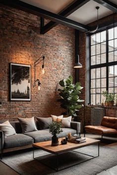 an industrial living room with brick walls and exposed ceilings, leather couches, coffee table, and potted plant in the corner