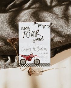 a motorcycle themed birthday party is set up on top of a bed with a sign that says, meet four speed