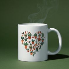 Enjoy your favorite drink in this charming garden-heart mug featuring a Scandinavian-inspired design of plants, birds, and gardening tools arranged in a heart shape. A perfect gift for plant moms, garden lovers, and anyone with a green thumb. Ideal for cozy mornings in the garden or as a stylish addition to your kitchenware. Makes a great garden-themed gift for birthdays, holidays, or everyday use.