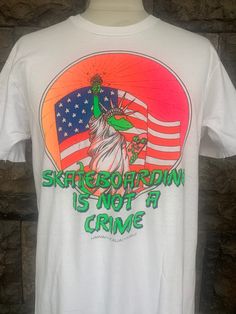 "Vintage 90s Skateboarding Is Not A Crime T-shirt Item Condition: Pre-Owned (Used) condition. please see pictures Size on Tag: L, Please check measurement Tag : Hanes ------------ Measurement: ------------- Chest (Pit to Pit) 20\" Length 28\" Shipping: Worldwide ---------- Standard Shipping 14-30 Days Express 5-8 Days I can do combined shipping +Add USD 5 shipping for each additional items!" Graffiti Print T-shirt For Skateboarding, White Graphic Print T-shirt For Skateboarding, Vintage Short Sleeve T-shirt For Skateboarding, Graphic Print T-shirt For Summer Skateboarding, Summer Graphic Print T-shirt For Skateboarding, Retro Screen Print T-shirt For Skateboarding, Screen Print T-shirt For Summer Skateboarding, Graphic Tee For Skateboarding, Graphic Tee For Skateboarding In Summer