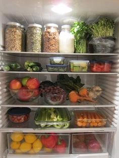 an open refrigerator filled with lots of different types of vegetables and fruits in it's doors