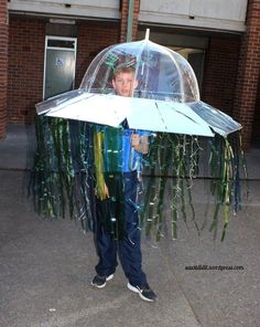 a man holding an umbrella made out of plastic