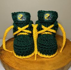 Green Bay Packers baby booties, size 3-9 months. Go Pack Go! A nice thing about crocheted booties is that they fit loose or tighter as infants grow without crowding toes.  If you'd prefer a different size, team, style or item, please message me.  Custom requests are never a problem, providing the necessary time and materials are available. I'll do my best to create inspired work, specifically tailored to meet your needs and deliver joy! Green Bay Packers Baby, Packers Baby, Slippers Boots, Jordan Shoes Retro, Football Gear, Go Pack Go, Booties Shoes, Crib Shoes, The Pack