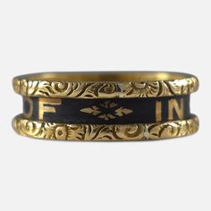 Victorian 18ct yellow gold and black enamel memorial mourning ring, inscribed with 'IN MEMORY OF' within a gold foliate border and 'Mary Alice Holbrey, Born May 12, 1860. Died April 17, 1873' inside. Hallmarked Birmingham, 1874, '18' for 18 carat gold. * Period: Late 19th Century. * Date: 1874. * Maker: 'H&U'. * Measurement: UK size M (leading edge), US size 6 1/4 (leading edge). Band width approximately 5.7mm. * Weight: 4.5 grams. Condition: Good, with minor surface scratches. Enamel in good co Black Heirloom Ceremonial Jewelry, Black Heirloom Jewelry For Ceremonial Occasions, Black Heirloom Jewelry For Ceremonial Use, Vintage Gold Enamel Ring Stamped 14k, Luxury Gold Ceremonial Enamel Ring, Luxury Gold Enamel Ring For Ceremonial Occasions, Gold Luxury Ceremonial Enamel Ring, Victorian Gold Engraved Collectible Ring, Victorian Gold Engraved Ring With Decorative Band