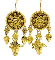 Crafted with intricate artistry and symbolic significance, these gold dangle earrings evoke the mystical allure of a dream catcher motif. Cast in luxurious 22 karat yellow gold, these earrings exude an aura of opulence and timeless elegance. There are three dangles off each earring; the center has a carved cow head and delicately sculpted acorns flank each side. The hooks of the earrings, crafted from durable 18 karat gold, ensure both stability and longevity, balancing the softness and malleabi Cow Head, Gold Dangle Earrings, Yellow Gold Earring, Fine Jewelry Collection, Gold Earrings Dangle, Earrings Set, A Dream, Earring Set, Dream Catcher