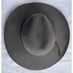 This authentic, high-end, handmade 50/50% Beaver/European Hare felt cowboy hat  has a leather band. The 3.75” brim has a slight curl. It is a size 7, and the inner band measures 22”. Curved Brim Fur Felt Hat Bands For Rodeo, Western Style Fur Felt Fedora With Curved Brim, Rigid Flat Brim Felt Hat For Ranch, Rigid Flat Brim Felt Hat For Country Events, Western Style Wide Brim Wool Fedora, Curved Brim Fur Felt Hat For Ranch, Western Style Fur Felt Hat Band With Curved Brim, Western Fedora With Curved Brim In Fur Felt, Rigid Brimmed Felt Hat For Ranch