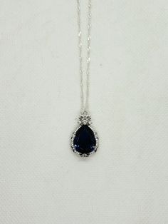 A beautiful blue sapphire surrounded by glittering white topaz accent stones set in sterling silver. Necklace Sapphire, Blue Sapphire Necklace, Carson City, Sapphire Necklace, Sapphire Stone, White Topaz, Stone Settings, Beautiful Blue, Sterling Silber