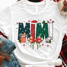 a t - shirt with the word mmm on it and christmas decorations around it,