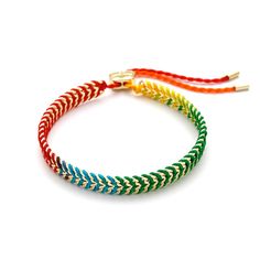 This boutique jewelry bracelet is handmade and features a gold plated design. The rainbow ombré woven pattern adds a unique and colorful touch to any wrist. Multicolor Woven Bracelet Jewelry, Elegant Adjustable Rainbow Bracelet, Luxury Rainbow Colored Bracelet, Luxury Rainbow Bracelets, Luxury Rainbow Bracelet Jewelry, Nautical Jewelry, Bridal Engagement Rings, Silver Anklets, Childrens Jewelry