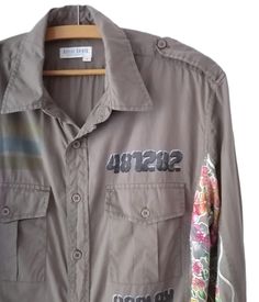 Vintage botton down blouse, REPLAY army green woman shirt with labels and flowers L   Bust: 116 cm/ 46 in Lenght: 75 cm/ 30 in Sleeve lenght: 65 cm/ 26 in Sholders: 45 cm/ 18 in Size tag : L Materials: 100% cotton  Condition: very good vintage condition Defects: none See more like this in my shop: https://www.etsy.com/shop/VintageInsparation?ref=seller-platform-mcnav Olive Long Sleeve Shirt For Spring, Spring Military Style Fitted Tops, Fitted Military Tops For Spring, Olive Cotton Shirt For Spring, Spring Military Style Collared Tops, Military Style Collared Tops For Spring, Military Collared Tops For Spring, Spring Military Green Tops, Green Military Tops For Spring