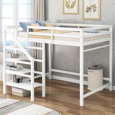 a white bunk bed sitting on top of a hard wood floor next to a window