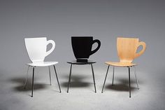 three chairs with different types of cups sitting on top of each other in front of a gray background