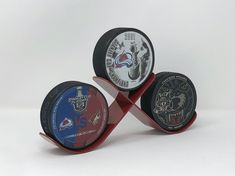 three hockey pucks are stacked on top of each other