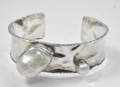 "Designer JS 925 Sterling Silver Cuff Bracelet. Hammered sterling design with jagged design edges and irregular freshwater cultured pearls. Stamped JS925. 34.2 grams. 5.75\" long x 2.5\" wide with a 1\" gap. KB326020" Modern Silver Pearl Bracelet With Oyster Design, Large Cuff Bracelet, Liquid Silver, Vintage Cufflinks, Sterling Silver Cuff Bracelet, Funky Jewelry, Freshwater Cultured Pearls, Sterling Silver Cuff, Silver Cuff Bracelet