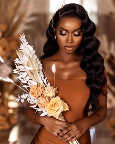 a woman with long hair holding flowers in her hand and looking at the camera while wearing an orange dress