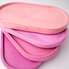 three pink plates stacked on top of each other