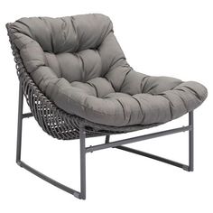 a gray chair sitting on top of a metal frame with a cushion in front of it