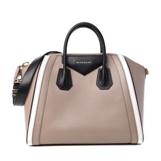 This Is An Authentic Givenchy Calfskin Medium Tri-Color Antigona In Black, White, And Beige. This Elegant Tote Is Crafted Of Luxurious Smooth Taupe Calfskin Leather With White And Black Leather Trim. The Bag Features Thin And Sturdy Rolled Leather Top Handles, An Optional Shoulder Strap, Gold Hardware And Expansive Sides. The Top Opens With A Zipper To A Spacious Black Fabric Interior With Zipper And Patch Pockets. Condition Is Very Good. Exterior Has Corner Wear, Scuffs. Handles Has Scuffs. Hardware Has Scratches. Comes With Dust Bag And Strap. Base Length 13.25in / Height 10.75 In / Width 7.75 In / Drop 3.00 In / Drop 11.00 In Givenchy Bags, Givenchy Bag, White And Beige, Leather Top, Tri Color, Leather Trim, Womens Tote Bags, Black Fabric, Leather Trims