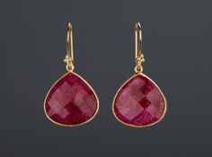 This pair of large ruby earrings would be a nice reward for yourself or a great gift for your mother or best friend. The pendant has an attractive ruby stone set in gold plated bezels: 1. Stone: ruby 2. Stone shape & size: pear shape 25 x 20 mm ; heart 20 x 20 mm 3. total length: pear 42 mm; heart 36 mm 4. bezel material: gold vermeil or sterling silver 5. earring hook: gold vermeil or sterling silver 6. an optional custom jewelry card printed with your own message, if you are sending these Red Ruby Drop Earrings, Red Ruby Pear-shaped Earrings, Red Pear-shaped Earrings For Gift, Elegant Pear-shaped Ruby Jewelry, Ruby Teardrop Earrings For Party, Pear-shaped Ruby Jewelry Gift, Elegant Gemstone Teardrop Earrings For Gift, Ruby Earrings With Ear Wire For Gift, Ruby Teardrop Earrings Fine Jewelry