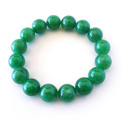 "Bright Green Jade 12mm Bead Stretch Bracelet. 16 beads total. Unstretched inside dimension 2\". Ancient Chinese culture has revered Jade for centuries. Jade is considered the health, wealth and longevity stone, which is found in different colors that can be used on the appropriate Chakra based on its particular color. Overall, Jade is a gentle natured stone, it is loving, soothing, caring, and uplifting. PLEASE NOTE: I can fit up to FOUR items in our Priority Mail Flat Rate envelope. Multiple p Cheap Hypoallergenic Green Stretch Bracelet, Cheap Green Beaded Jewelry, Jade Stretch Bracelet For Healing With Round Beads, Green Round Beads Stretch Bracelet For Meditation, Green 8mm Beads Stretch Bracelet For Meditation, Spiritual Jade Stretch Bracelet With 8mm Beads, Hand-strung Jade Stretch Bracelet With Round Beads, Jade Gemstone Beads Stretch Bracelet, Jade Stretch Bracelet With Gemstone Beads