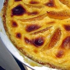 a close up of a pie in a pan on a table