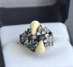 Antique highly detailed 835 silver ring decorated with genuine deer teeth. Size: US 6 1/4, UK M Ring's head measures: 1.8 cm x 1.9 cm (0.7" x 0.7") Weight 4.7 grams Hallmarked: 835, maker's mark Very good vintage condition The box on the photos for display only! Will be delivered by tracked and signed mail. Thank you for looking. Please see my other items. Vintage Hand-cast Skull Ring For Gift, Maker's Mark, Lithuania, Makers Mark, Rings Statement, Silver Ring, Statement Rings, Deer, Jewelry Rings