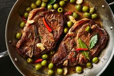 two steaks and green peas in a pan