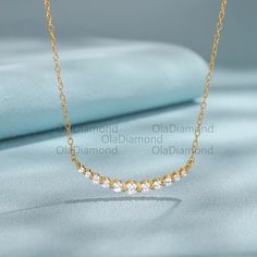 14k Solid Gold Round Moissanite Elegant Curved Pendant Chain Minimalist Necklace, Moissanite Curved Pendent 925 Sterling Silver Gift Jewelry ★ Info ● Stone Details : * Stone: Moissanite * Stone Quality : FG - VVS * Stone Shape : Round Cut * Total No. Of Stone : 11 * TCW : 0.88 ct. Approx ★ Material Details : * Material : Solid Gold * Natural : 100% Natural * Necklace Length : 18 inch (16 inch + 2 inch Adjustable) * Chain Size : 1.10 mm ● Metal  * 925 Sterling Silver, Yellow Gold Plated,10k,14k,18k Gold * More option in gold color : Rose Gold,Yellow Gold,White Gold ●  Ring size can be choose from the selection box. Larger and smaller sizes are available as well. Priced upon request. ★ This jewelry can also be made with real diamonds. Contact me! ★ Need rush order? contact me! ★ Need custom Minimalist Moissanite Diamond Necklace For Anniversary, Minimalist Gold Moissanite Diamond Necklace, Minimalist Moissanite Necklace For Anniversary, Moissanite Pendant Necklace In Yellow Gold, Moissanite Yellow Gold Pendant Necklace, Minimalist Moissanite Necklace With Prong Setting, Yellow Gold Moissanite Pendant Necklace, Minimalist Gold Moissanite Necklace, Nature Necklace