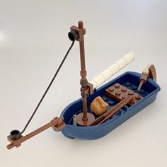 a small toy boat with two oars on it