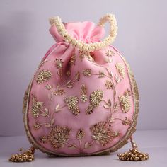 artisian handmade flower texture zardosi boho embroidered wedding potli bag handbag | beautiful bridemaids gifting handbag Designed with the heart, this beautiful Potli or batawa bag are eye catchy and made of premium material. Key Features: Embroidery art work This potli is good match with both Indian and western outfits and are superb for wedding and festive parties This would be best complement to your designer saree, lenhga or any other kind of dress This is the combination of traditional an Elegant Pink Shoulder Bag For Festivals, Gold Floral Embroidered Potli Bag, Traditional Resham Embroidery Potli Bag For Festive Season, Pink Handwork Pouch Bag, Festive Dori Work Shoulder Bag, Bollywood Style Festive Bags With Resham Embroidery, Traditional Bags With Resham Embroidery For Festive Occasions, Traditional Gota Work Bag For Reception, Gold Bag With Resham Embroidery For Reception