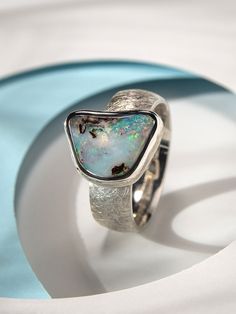 Large sterling silver ring with natural Boulder Opal opal stone origin - Australia opal measurements - 0.35 х 0.51 in / 9 х 13 mm opal weight - 5.3 carats ring weight - 8.5 grams ring size - 8.75 US ref No 0821 Modern Opal Open Ring For Anniversary, Modern Silver Opal Ring For Anniversary, Modern Opal Ring For Anniversary, Modern Sterling Silver Opal Ring Gift, Modern Sterling Silver Opal Ring For Gift, Minimalist Silver Opal Ring, Luxury Silver Opal Ring With Bezel Setting, Luxury Artisan Silver Opal Ring, Blue Opal Open Ring In Sterling Silver