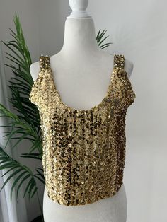 Gold sequin, crop top, with beaded straps. Top slips on overhead and is fully lined. In overall good vintage condition with no major flaws, no missing beads or sequins, although there is a spot on the inside lining that is not visible on the outside. Appears to be homemade, no size tags or labels. Measurements Chest 34in/86.5cm Length 17.5in/44.5cm (top of strap to hem) *Please keep in mind that unless otherwise noted, all items in my shop are used or previously owned, normal wear and tear is expected, flaws that are noted are range from major to minor, things like a missing stitch here or there my not be included. *Please read all policies on this and our policy page prior to making your purchase. *Please feel free to message me with any questions you may have as returns are not accepted. Gold Sequin, Cropped Tube Top, Little Miss, Vintage Gold, Vintage Finds, Womens Clothing Tops, Sleeveless Top, Crop Tops, Clothes For Women