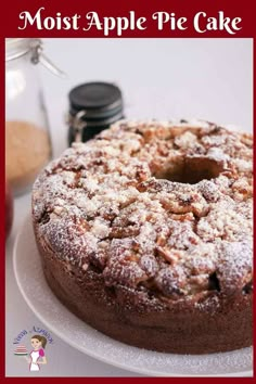 an apple pie cake on a plate with the words moist apple pie cake above it