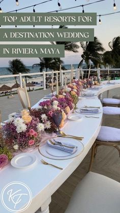 a long table set up with flowers and plates on it for an outdoor wedding in riviera maya