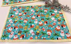 two placemats with christmas themed designs on them