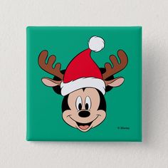 a cartoon character wearing a santa hat with antlers on it's head and nose