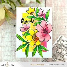 a card with flowers on it and the words thank written in black ink, sitting next to a bouquet of flowers