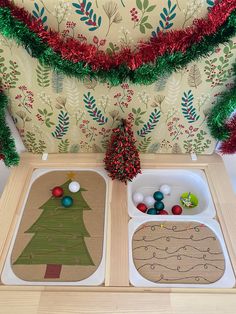 two trays with christmas decorations on them