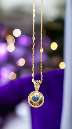 Reminiscent of the rich gold and vibrant blues of ancient Egypt, this 'Pharoah's Eye' solid 9ct gold pendant embraces Egypt's timeless colour combination in a modern design. You're a classy lady yourself and want to wear high quality, handmade jewellery that's a little different but not 'out there'. The carefully selected rich blue sapphire is impeded in a flush setting nestled within 3 grams of solid gold. This most ancient of precious metals as been tested and hallmarked as 9ct gold (375 hallmark) by the London Assay Office, so you can buy with confidence. This is not a gold plated piece, but is solid gold - just as the pharaohs and their queens wore. Your handcrafted piece is immediately ready to wear with the chain included and will be carefully packaged in a Beebee Jewellery box, as s Hallmarked Yellow Gold Birthstone Necklace Gift, Gift Round Pendant Birthstone Necklace With Jewels, Round Birthstone Necklace For Celebration, Traditional Yellow Gold Jewelry With Birthstone, Hallmarked Round Birthstone Necklace For Anniversary, Round Hallmarked Birthstone Necklace For Anniversary, Round Birthstone Jewelry For Celebration, Gold Formal Birthstone Necklace With Round Pendant, Gold Birthstone Necklace With Bezel Setting Round Pendant