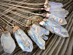 "Large raw Angel Aura Quartz crystals dipped in your choice of gunmetal, silver, yellow gold or rose gold plating! These beautiful large crystal points measure approximately 40 - 60mm long and come on a long 30\" chain in matching metal color. You may choose your chain finish: Gunmetal, Real .925 Sterling Silver or Silver plated, Real 14K Gold filled or Gold plated, OR Real 14K Rose gold filled or Rose gold plated. Finally, you may choose your chain style, bead, link, or cable. All chains are sh Angel Aura Quartz Necklaces, Crystal Jewelry Diy, Raw Quartz Necklace, Quartz Choker, Gold Crystal Necklace, Aura Quartz Cluster, Clear Quartz Necklace, Long Necklace Boho, Beautiful Crystals