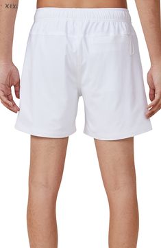 Soak up the sun or take a dip in these cool swim trunks crafted from easy-moving stretch fabric. Elastic/drawstring waist Mesh lined Side pockets; key loop pocket 92% polyester, 8% elastane Machine wash, line dry Imported White Nylon Swim Trunks For Beach Season, White Swim Trunks With Drawstring For Vacation, White Drawstring Swim Trunks For Vacation, White Stretch Swim Trunks Athleisure Style, White Stretch Swim Trunks For Athleisure, White Athleisure Swim Trunks Short Length, White Swimwear With Pockets In Short Length, White Nylon Bottoms For Poolside, Casual White Swimwear With Elastic Waistband