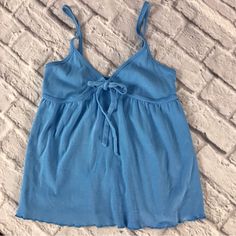 Nwot Victoria’s Secret Cotton Babydoll Tank Moda International Excellent New Condition, No Flaws Design Is Babydoll Swing Below Bust Cups 100% Cotton Blue Small Kinda Of A Semi- Raw “Like” Edge Hem, Not Sure What It’s Called, It Is Seamed So It’s Not Exactly Raw, But Has A Distressed Look That Is To Add To The Y2k Fashion Style. I Have These In Light Pink And Coral, But Never Wore This Blue. Blue Cami Tank Top For Loungewear, Blue Cotton Tank Top For Loungewear, Blue Tank Top For Spring Daywear, Blue Tank Top For Daywear In Spring, Light Blue Sleeveless Cotton Sleepwear, Sleeveless Light Blue Cotton Sleepwear, Casual Blue Tank Top For Daywear, Blue Fitted Casual Sleepwear, Fitted Casual Blue Sleepwear