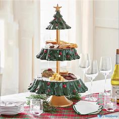 three tiered christmas tree platter with wine glasses