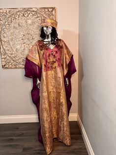 African/Nigeria bubu brocade outfit. One size. Oversized,And  Please note measurements: Width: 64inches Lenght: 62inches Bohemian Gold Floor-length Abaya, Gold Floor-length Bohemian Abaya, Gold Bohemian Floor-length Abaya, Festive Gold Thobe For Festivals, Bohemian Gold Kaftan For Festive Occasions, Gold Abaya For Festivals, Gold Kaftan For Ceremonial Festivals, Gold Long Abaya For Festivals, Festive Gold Bohemian Kaftan